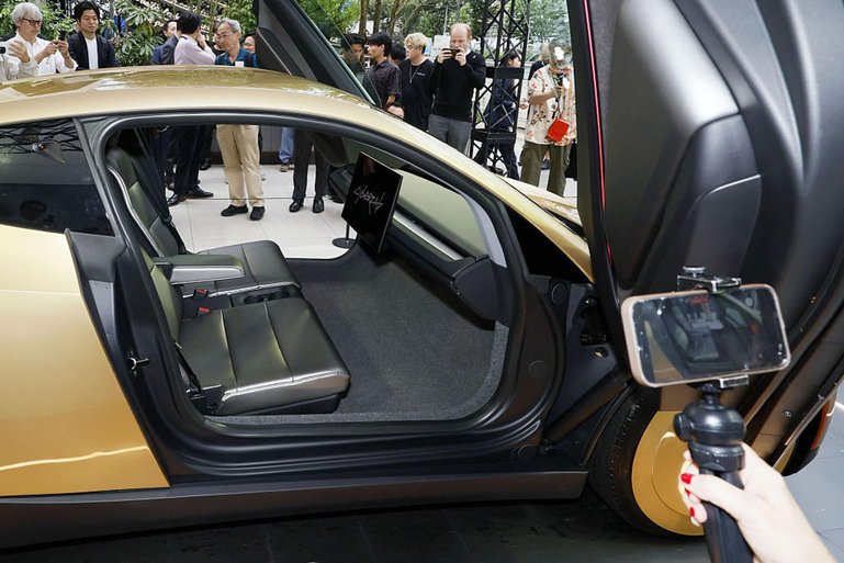 Tesla unveils driverless Cybercab in Japan