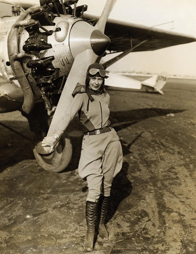 Elinor Smith Standing by Early Aircraft