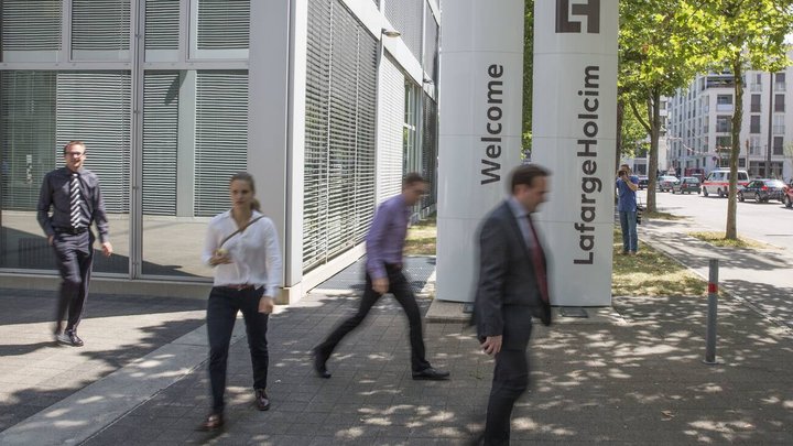 The new logo of LafargeHolcim on panels in front of the head quarters in Zurich, Switzerland, on Wednesday, 15 July 2015. LafargeHolcim today officially launched the new Group around the world and announced key elements of its ambitions for the future. (KEYSTONE/Patrick B. Kraemer)