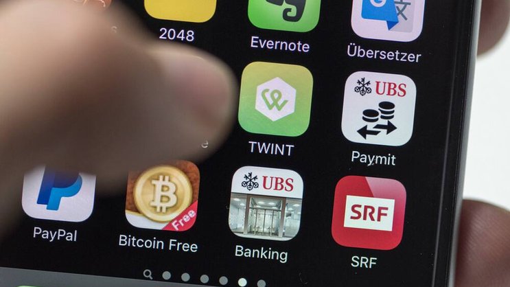 Twint und Paymit: Die beiden Bezahl-Apps fusionieren. Keystone