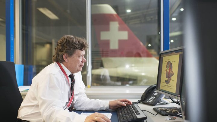 An employee prepares a maintenance at the aircraft maintenance center at Zurich Airport in Kloten in the Canton of Zurich, Switzerland, pictured on July 22, 2014. (KEYSTONE/Christian Beutler)