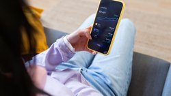 Person trading cryptocurrency on smartphone app