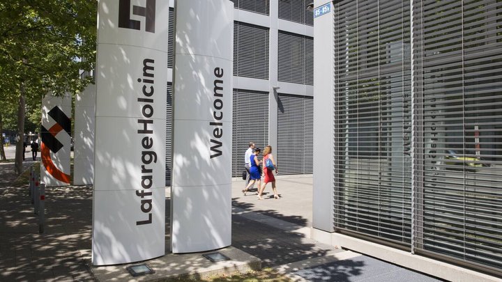 The new logo of LafargeHolcim on panels in front of the head quarters in Zurich, Switzerland, on Wednesday, 15 July 2015. LafargeHolcim today officially launched the new Group around the world and announced key elements of its ambitions for the future. (KEYSTONE/Patrick B. Kraemer)