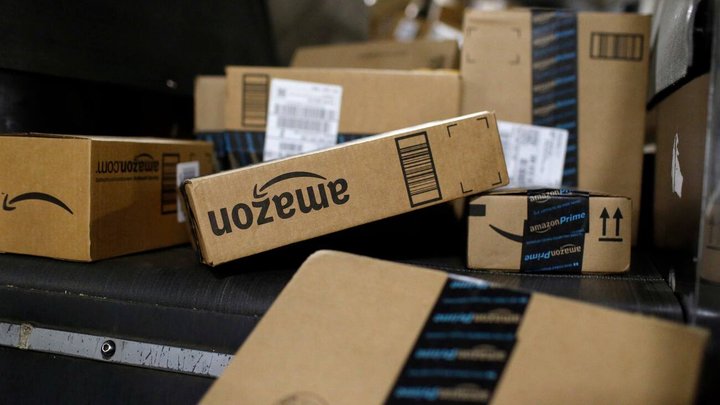 FILE - In this Nov. 20, 2015, photo, packages being shipped in Amazon boxes ride a conveyor belt at the UPS Worldport hub in Louisville, Ky. Amazon is already a huge part of many peopleâs lives. And its $13.7 billion deal for the organic grocer Whole Foods will likely bind its customers even more tightly. While Amazon is the clear leader in e-commerce, 90 percent of worldwide retail spending is still in brick-and-mortar stores, according to eMarketer. (KEYSTONE/AP Photo/Patrick Semansky)