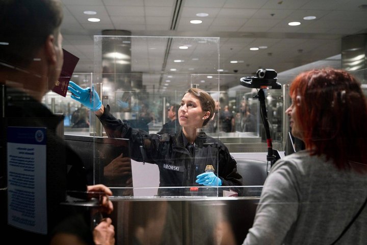 Syndication: Detroit Free Press CBP officer G. Barowski, center, screens international travelers Henning Radtke, left, and Jeanette Radtke upon entering U.S. Customs and Border Protection at McNamara Terminal at Detroit Metro Airport in Romulus on July 28, 2023. , EDITORIAL USE ONLY PUBLICATIONxINxGERxSUIxAUTxONLY Copyright: xSarahbethxManeyx USATSI_21948667